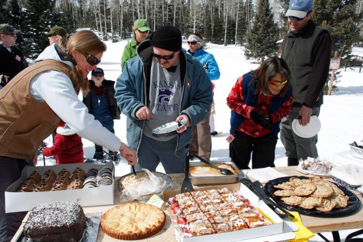 people eating desserts in the snow