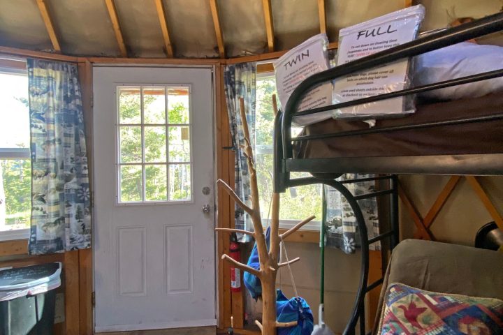 a close up of a bedroom next to a window