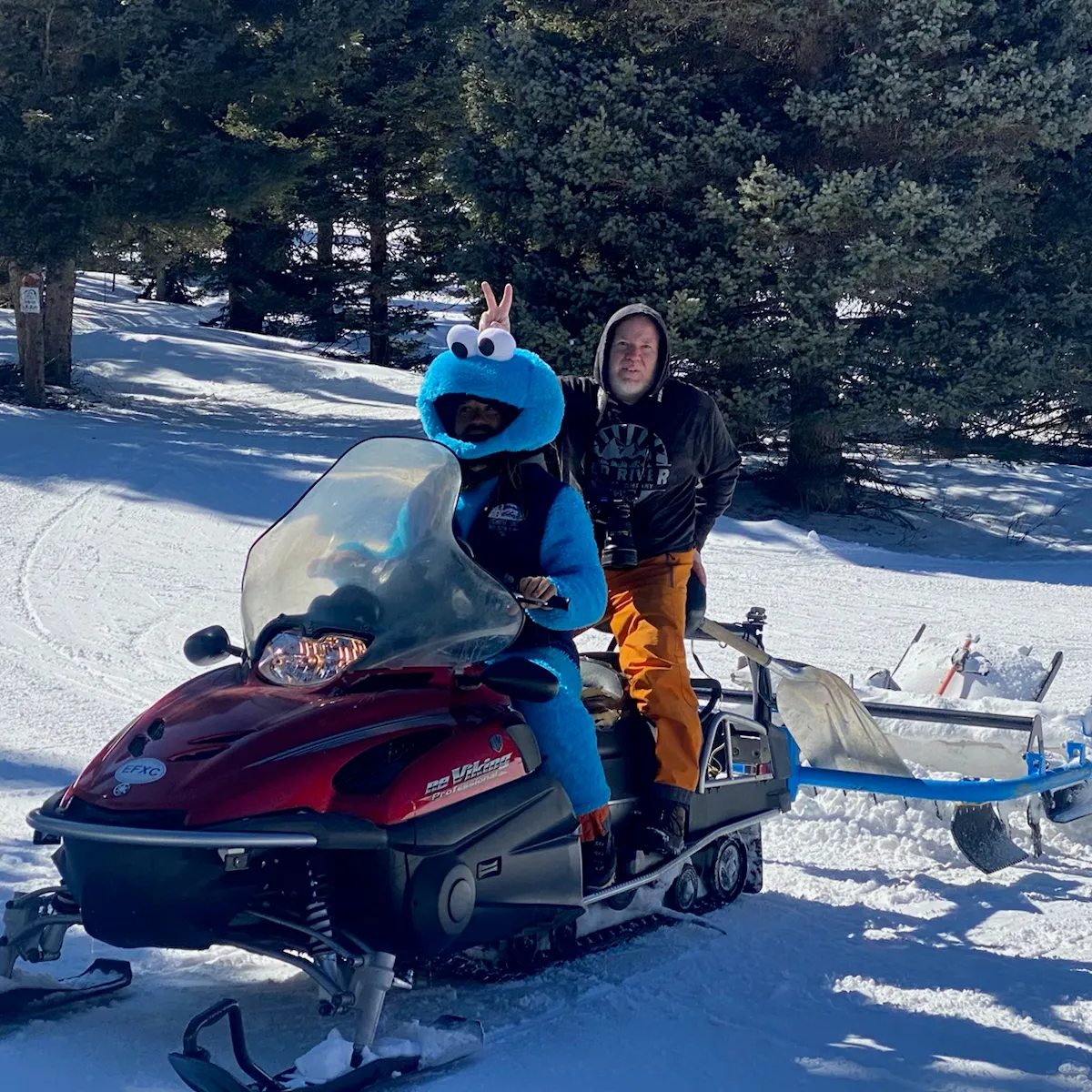 a man sitting on a snowmobile
