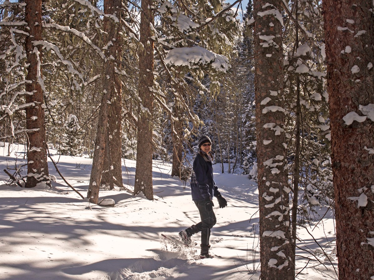 a man riding skis down a snow covered slope